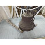 A cast metal bell moulded with deer and fruit, height 24cm