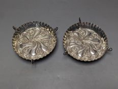 A pair of late Victorian repousse silver tri-handled shallow nut dishes, Vale Brothers & Serman,