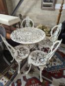 A Victorian style painted aluminium circular garden table, diameter 72cm, together with four chairs