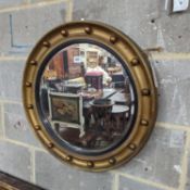 A Regency style circular gilt framed wall mirror, diameter 59cm