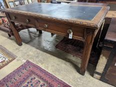 A Victorian Gothic style walnut two drawer library table, width 152cm, depth 78cm, height 76cm