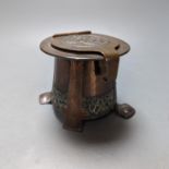 An Arts and Crafts copper and silver inkwell, unsigned, 9 cms high.