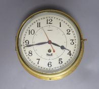 A Mercer brass bulkhead timepiece, 25 cms wide.