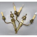 A pair of brass two branch wall sconces, 48 cms high not including bulbs.