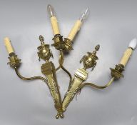A pair of brass two branch wall sconces, 48 cms high not including bulbs.
