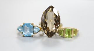 A modern 9ct gold and quartz set dress ring, gross 7.5 grams, a 10k and gem set ring, gross 3