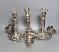 A pair of Victorian plated candlesticks and a two branch candelabrum, 51 cms high.
