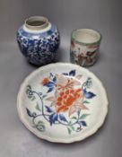 An Imari Japanese dish, a blue and white phoenix jar, and a famille verte brush pot with