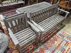 A Barlow type weathered teak garden suite, comprising rectangular table, length 149cm, depth 71cm,