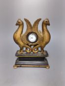 A carved and gilt watch stand, 22 cms high.