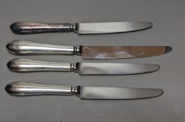 A modern set of twelve silver handled steel table knives and twelve dessert forks, Sheffield, 1979.