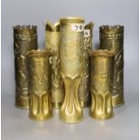 A collection of twelve WWI trench art shell casings, tallest 35 cms high.