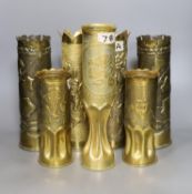 A collection of twelve WWI trench art shell casings, tallest 35 cms high.
