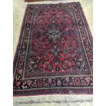 A Tabriz style red ground carpet, 290 x 190cm