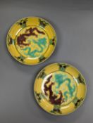 A pair of Chinese yellow, green and aubergine dragon dishes, Guangxu marks, 10cm.