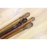 Two 19th century Greek walking sticks, a Japanese walking cane and an African cane