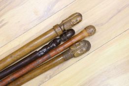 Two 19th century Greek walking sticks, a Japanese walking cane and an African cane