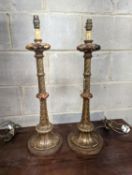 A pair of 1920's Italian gilt wood painted carved table lamps, height 60cm