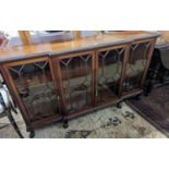 A 1920's Chippendale revival glazed mahogany break front dwarf cabinet, width 160cm, depth 43m,