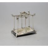 An Edwardian silver mounted hat pin? and ring stand, Mappin Bros. Birmingham, 1909, height 8.1cm.
