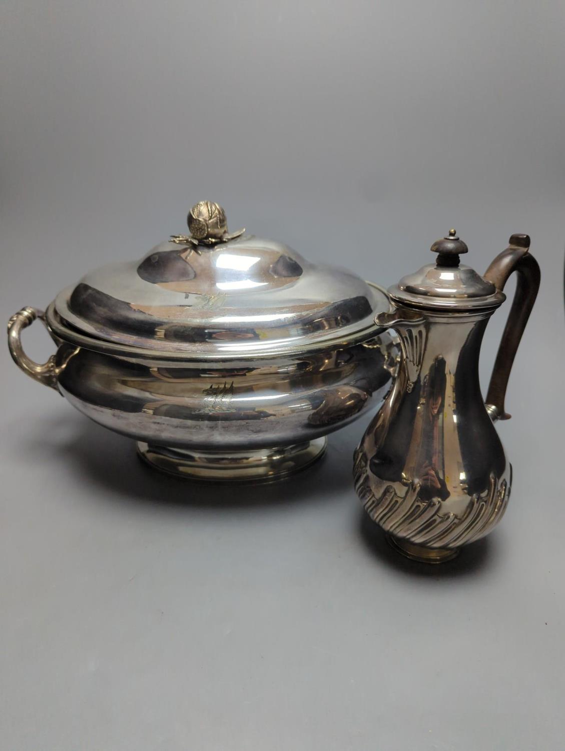 A plated oval two handled soup tureen and cover and a plated coffee pot, tureen, 39 cms wide.