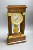 A French rosewood portico clock, with pendulum, no key, 44 cms high.