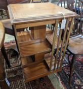 An Edwardian inlaid satinwood revolving bookcase, width 48cm, depth 47cm, height 85cm