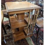 An Edwardian inlaid satinwood revolving bookcase, width 48cm, depth 47cm, height 85cm