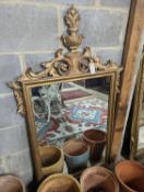 A 1930's French carved giltwood wall mirror, width 80cm,
