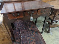 A George III mahogany side table with three drawers, width 75cm, depth 44cm, height 72cm