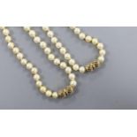 Two single strand cultured pearl necklaces, with 9ct clasps, (can be worn as one), overall 88cm.