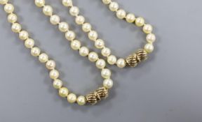 Two single strand cultured pearl necklaces, with 9ct clasps, (can be worn as one), overall 88cm.