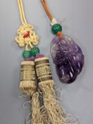 A 19th century Chinese carved amethyst pendant, 5cm., on ornate cord