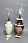 A Derby gilt and floral decorated lamp and Wedgwood lamp, tallest 30 cms high.