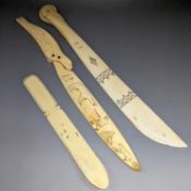 A 19th century Scrimshaw seal paperknife, 22cm., and two other engraved bone paperknives