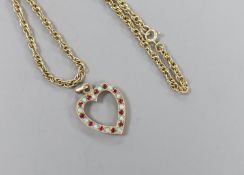 A modern 9ct gold, ruby and white opal set heart shaped open work pendant, 27mm and a 9ct gold