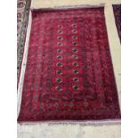 A Bokhara burgundy ground rug, 190 x 130cm