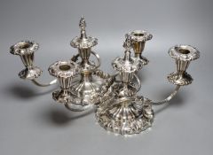 A pair of plated three-light candelabra, 33cms wide.