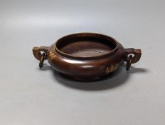 A Chinese gold splashed bronze censer, 22 cms high.