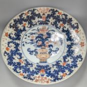 A large 17th/18th century Japanese Arita Imari palette charger, 55cm