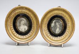A pair of 19th century oval gilt frames, 6.5cm. high, with inset monochrome prints