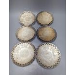 A set of six Persian white metal circular shallow dishes, with pierced borders, 16.3cm, 972 grams.