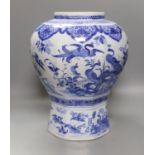 A large blue and white Delft vase, 44 cms high.