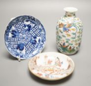 Two Chinese porcelain saucers, and a Chinese enamelled porcelain vase, 12.5cm., 18th century and