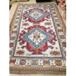 A Caucasian design ivory ground carpet, 270 x 172cm