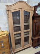 A French glazed pine two door armoire, width 100cm, depth 55cm, height 200cm
