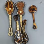 Five 19th century tortoiseshell miniature stringed instruments, longest 20cm.