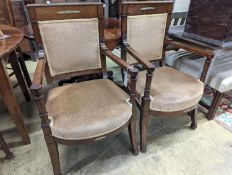 A pair of French Empire style mahogany gilt metal mounted elbow chairs, width 54cm, depth 50cm,