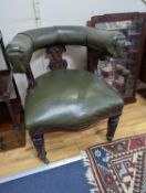 A Victorian mahogany tub framed chair upholstered in green leather, width 60cm, depth 58cm, height