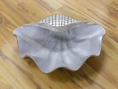 A cast aluminium clam-shaped ice bucket, 66 cms wide.